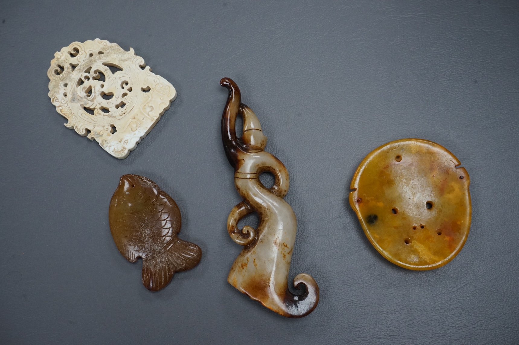 Four Chinese carvings and two bowls.(6). Largest carving 14.5cm long.